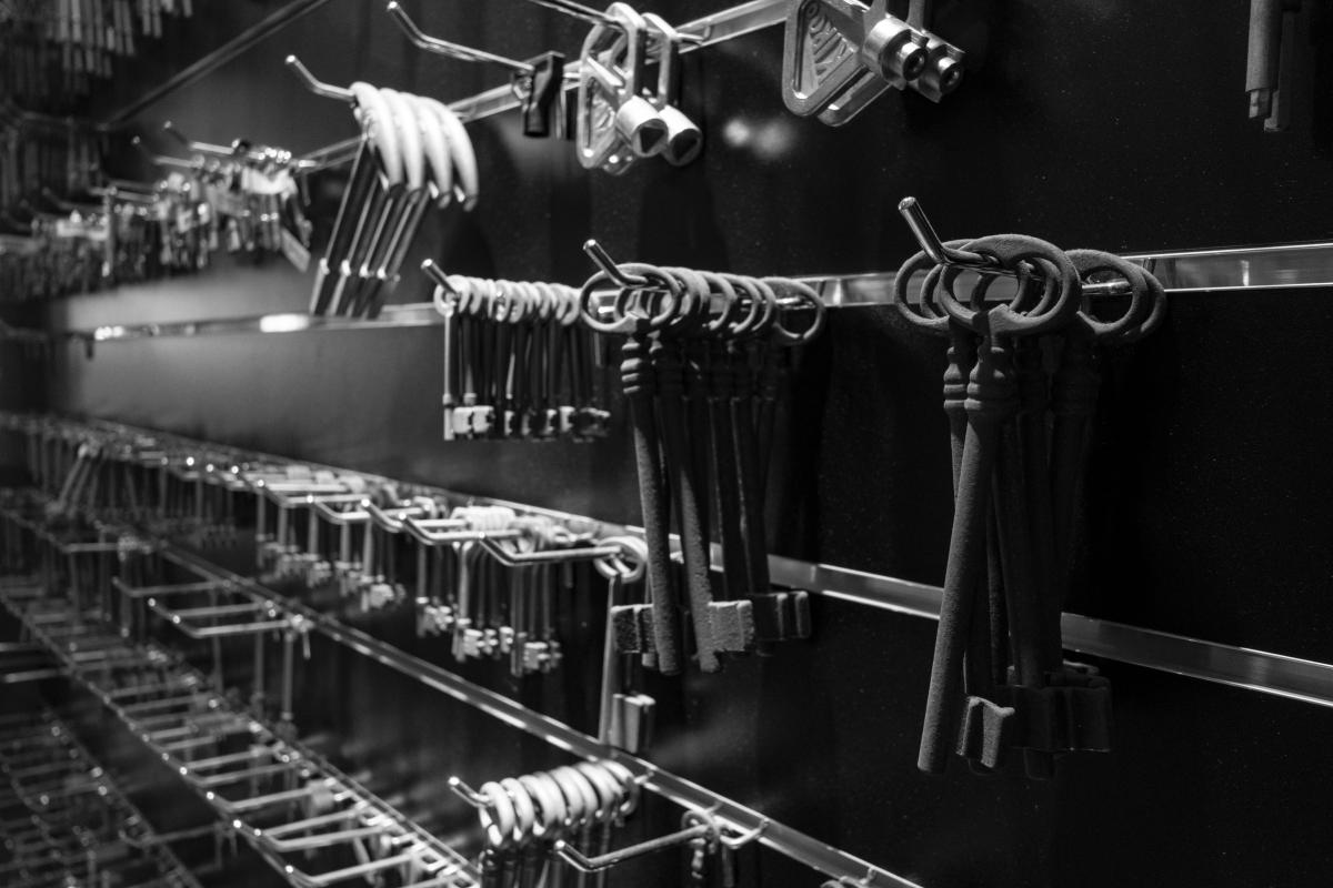 Rows of keys hanging on display hooks in a locksmith shop