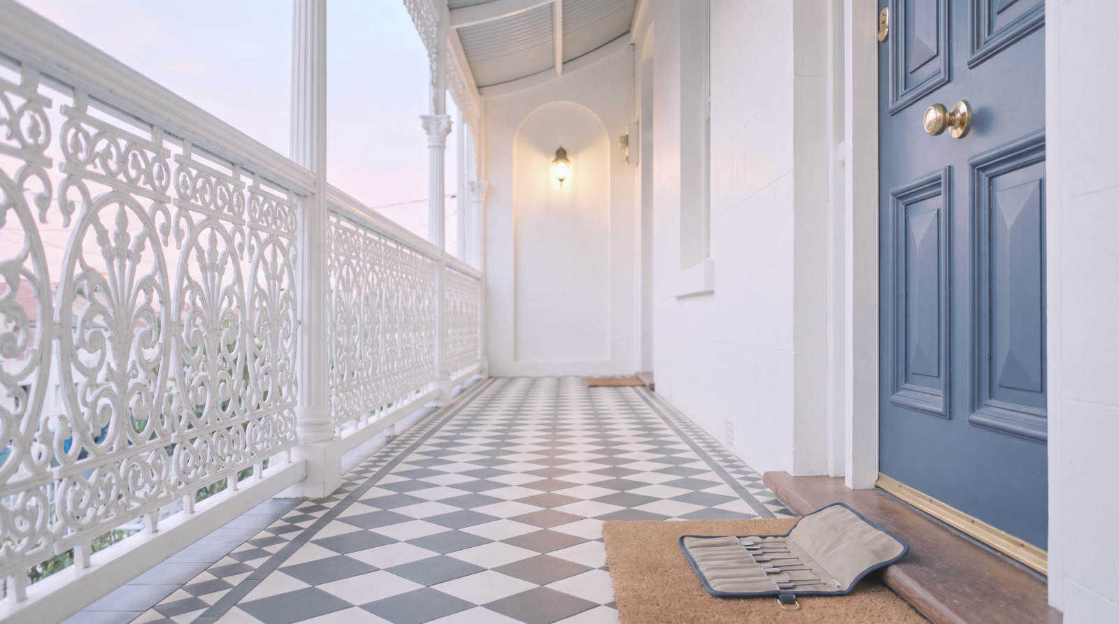 Elegant front door and tiled veranda at a residential entrance
