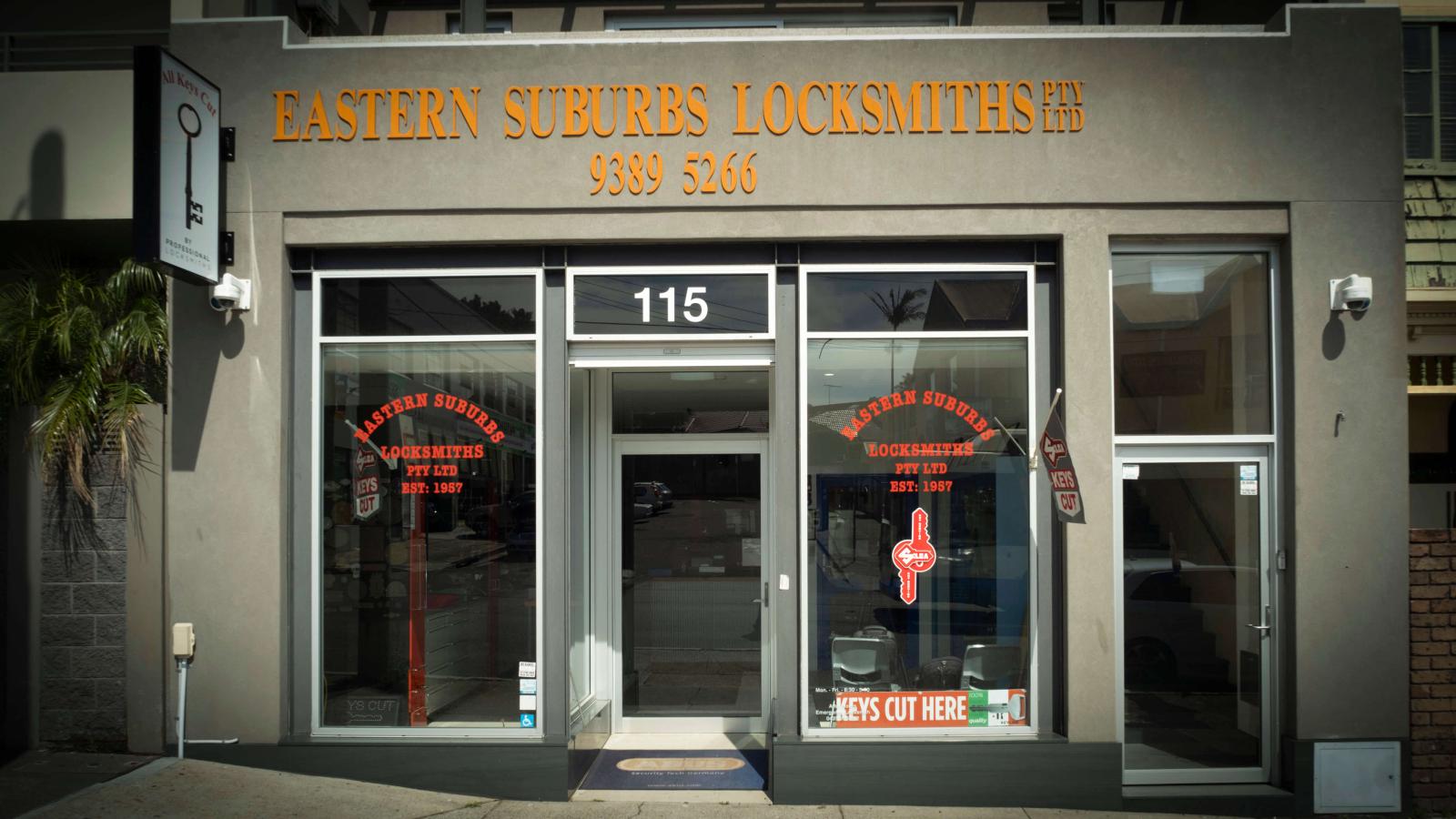 Street view of Eastern Suburbs Locksmiths shopfront with glass doors and security signage